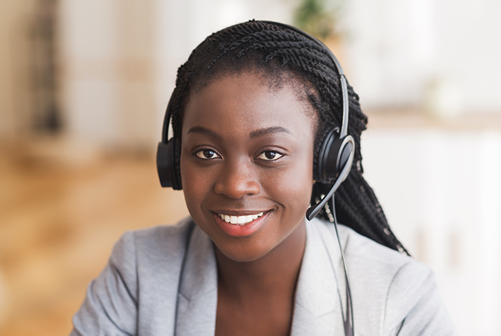 AdobeStock_308489704B Young Woman at a Call Center